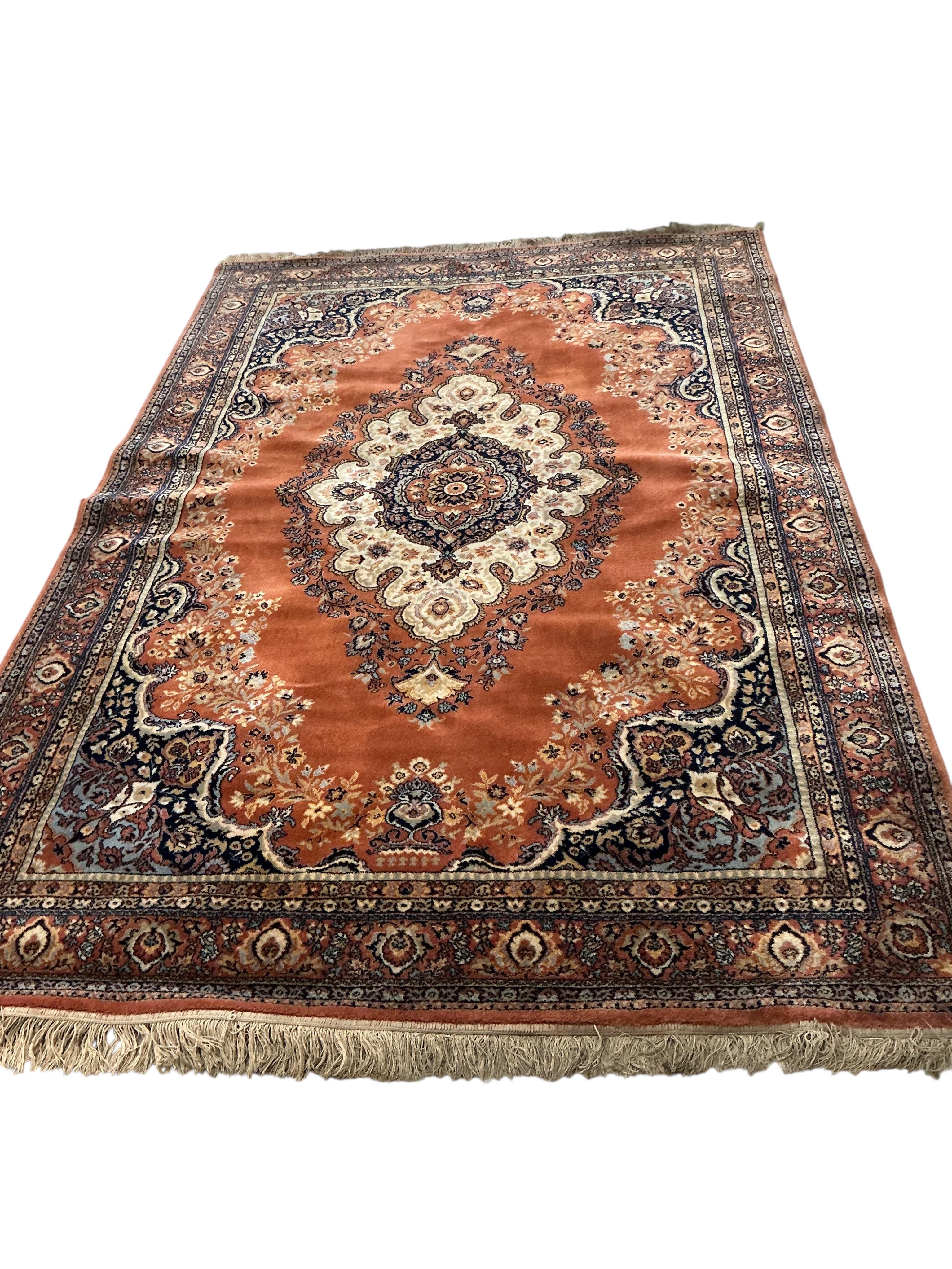 A Persian style machined blue ground carpet, 300 x 198cm